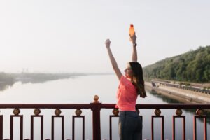 Slim lady in sport uniform enjoying life. Portrait from back of european girl looking at sky after training. - Abigail Mind Body Soul Benefits of Self-Esteem Activities ( 1. Improved Mental Health 2. Personal and Professional Development 3. Stronger Relationships 4. Greater Resilience)
